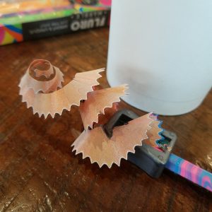 A curl of wood shaving from a pencil